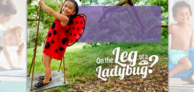 toddler with eczema on her arm in a lady bug costume